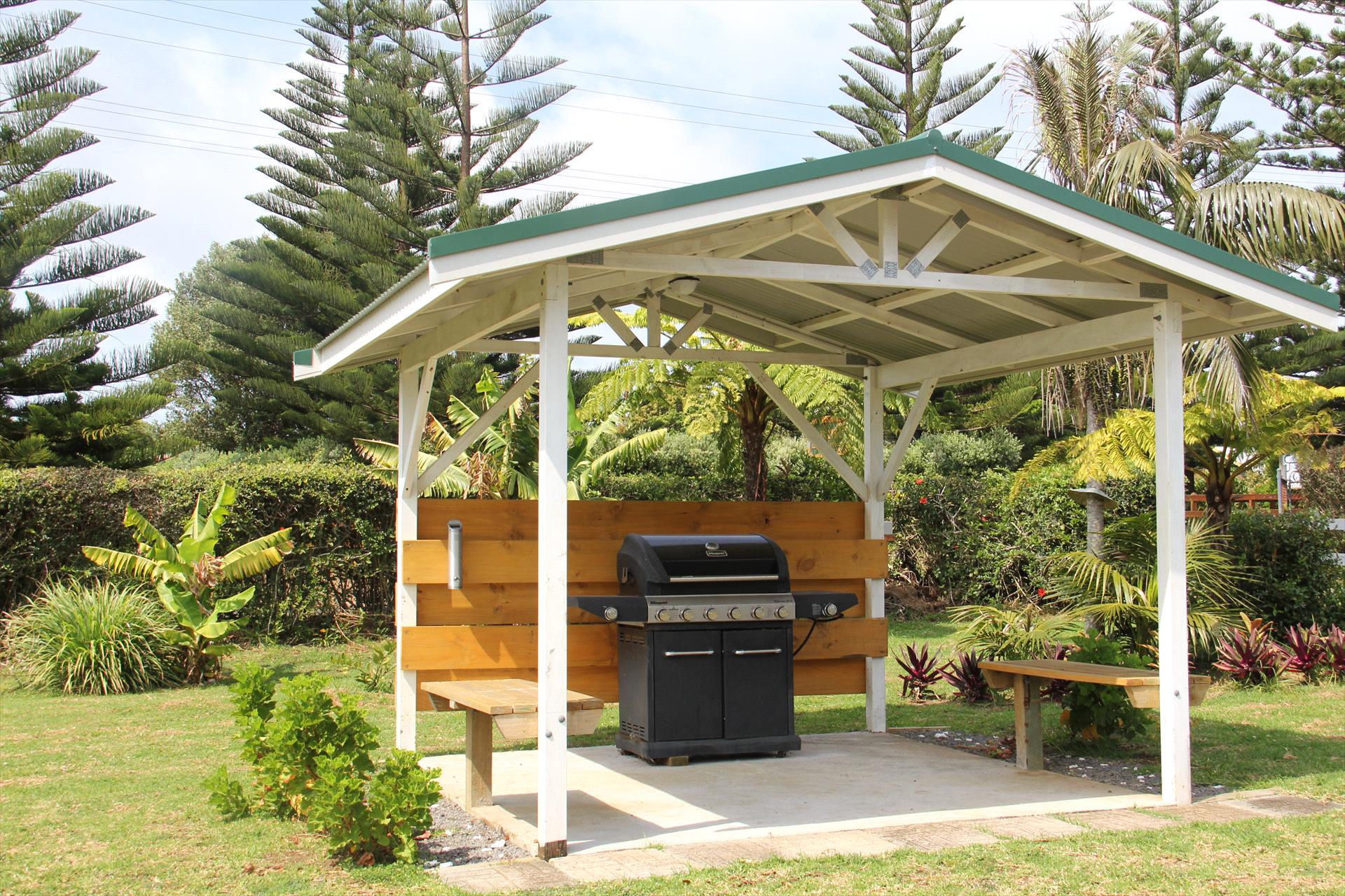 Covered barbecue area set among the gardens
