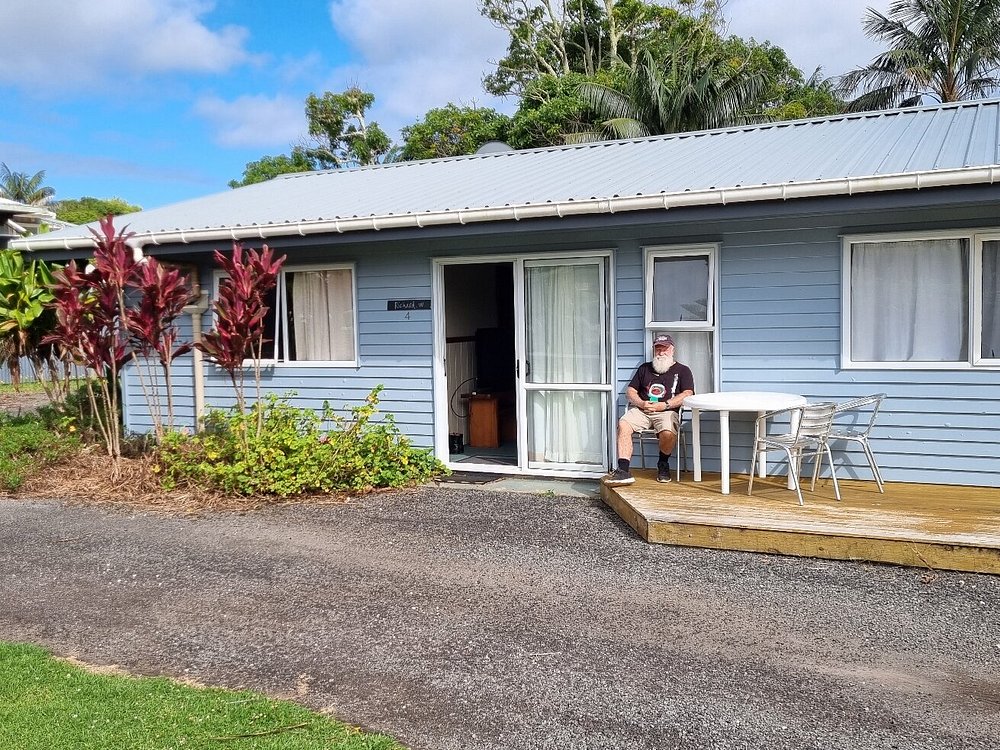Guest seated outside an apartment on its private deck